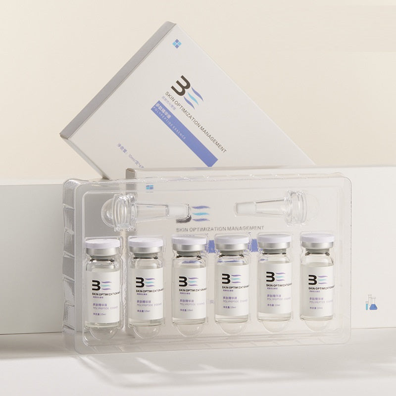 Set of medical vials with a clear plastic holder on a light background