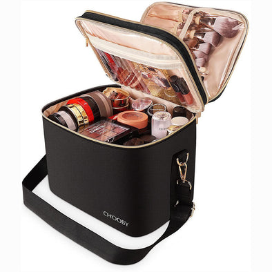 Black makeup bag with open lid displaying various cosmetic items, branded 'CHOObY'.